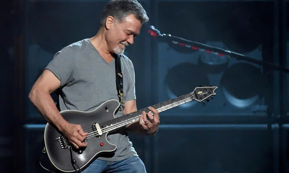 Eddie Van Halen playing the original EVH Wolfgang guitar.