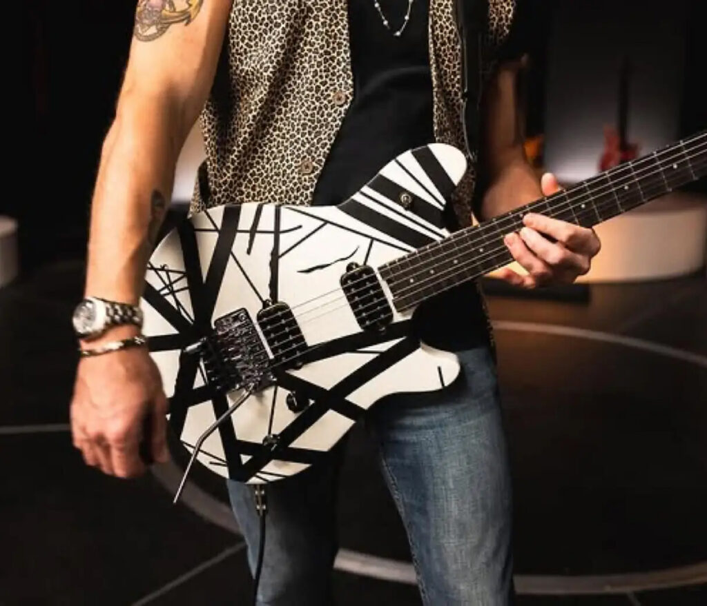Social UGC – Man holding EVH guitar