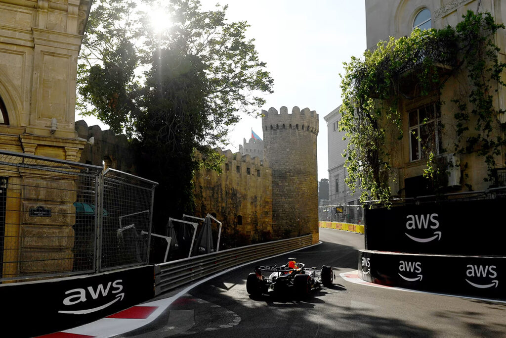 Red Bull driving around castle corner.