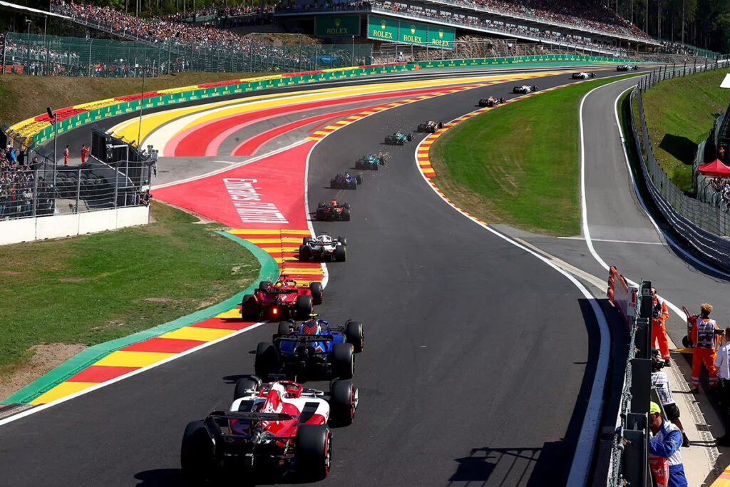 Cars driving up Eau Rouge corner.
