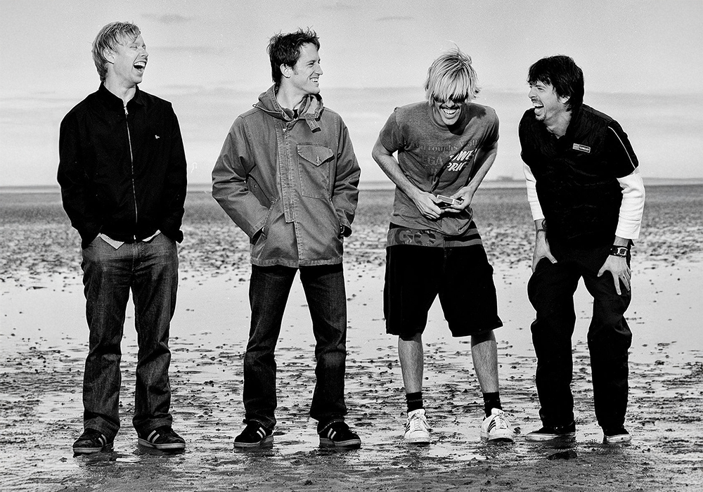 Dave, Taylor, Nate, and Chris on the beach laughing